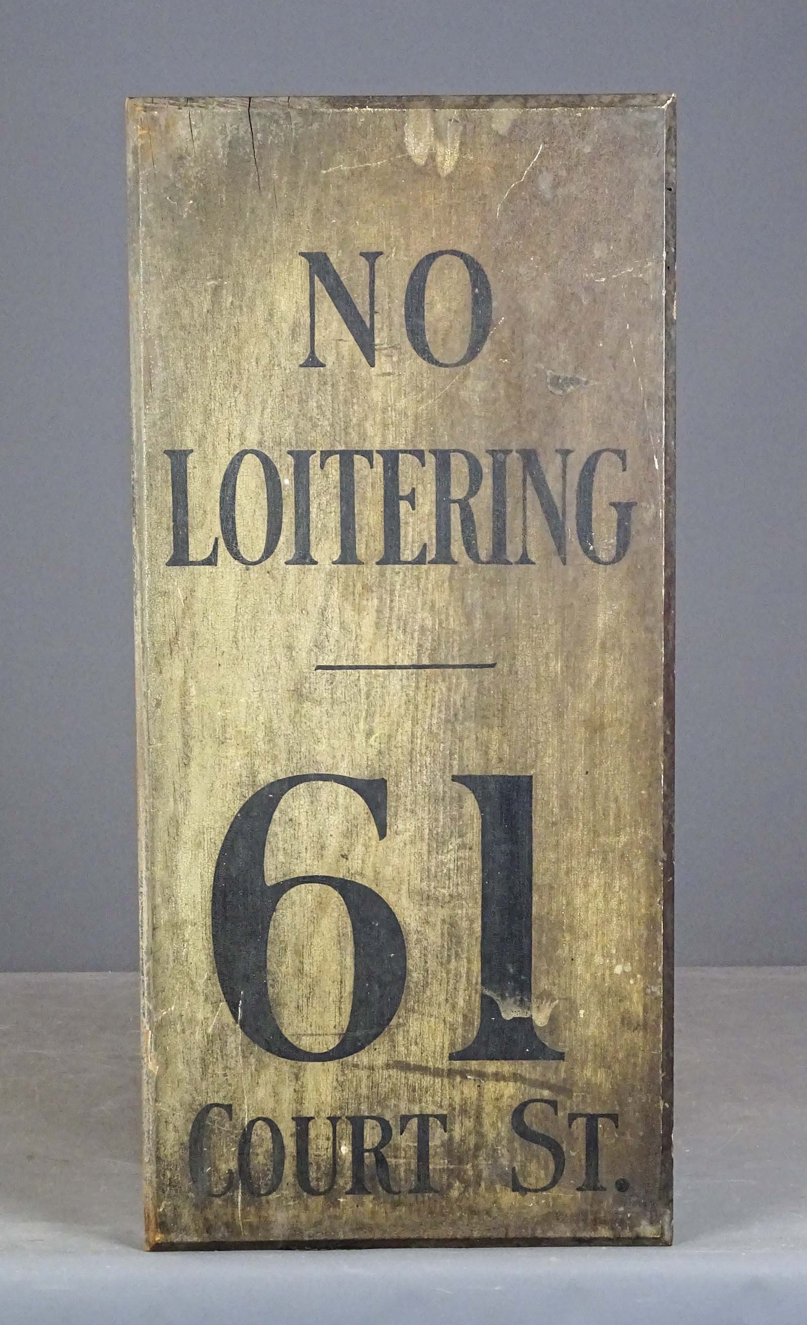 Trade Sign: Painted wooden trade sign "NO LOITERING 61 COURT ST.". 13" x 28".