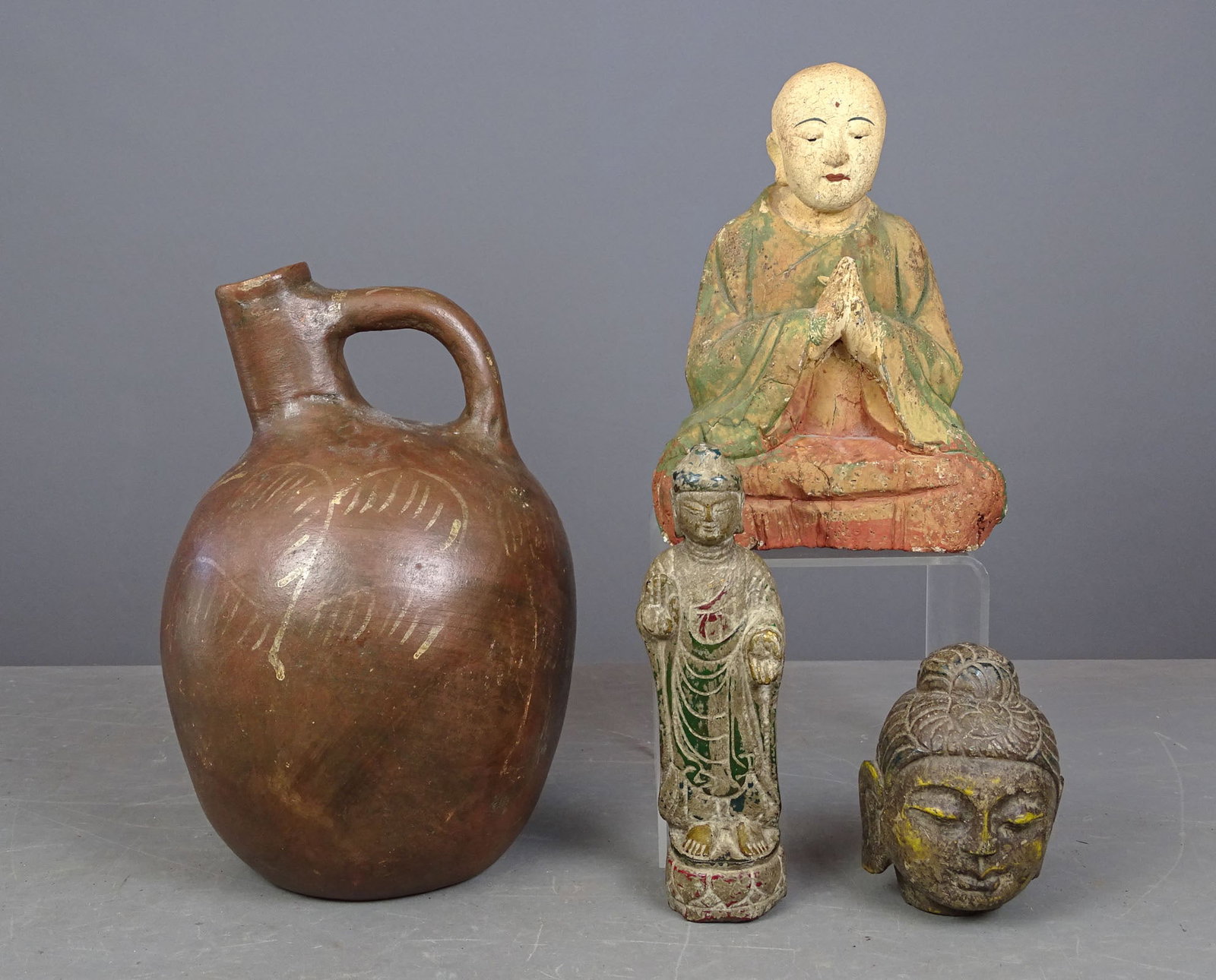 Asian Lot: Lot inclduing: Wooden Asian figure (9" L.), (2) stone pieces (5" and 9" Ht.), Mexican jug (12" Ht.).