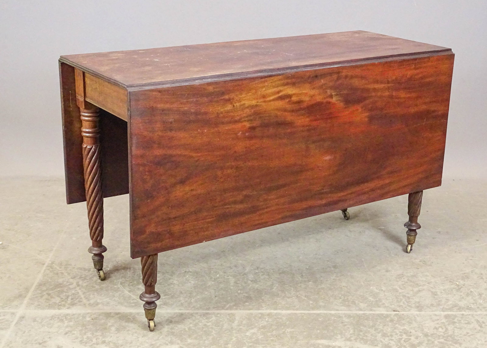 19th c. Mahogany Dropleaf Table: 19th c. Classical twisted leg dropleaf table. 47" x 19 1/2" with 19" leaves, 30" Ht..