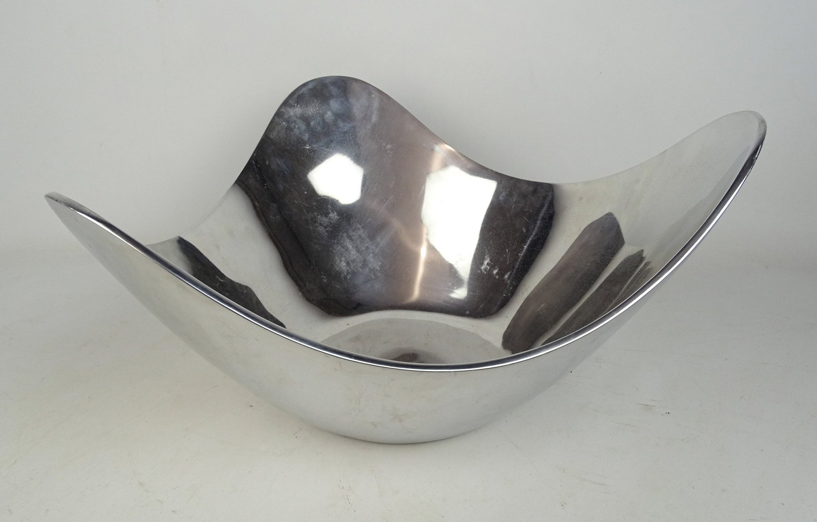 Nambe Modernist Bowl: Modernist bowl signed underside "nambe MT1352 Nambe LLC Alvaro Uribe 2019". Metal. 17" x 18" x 8" Ht..
