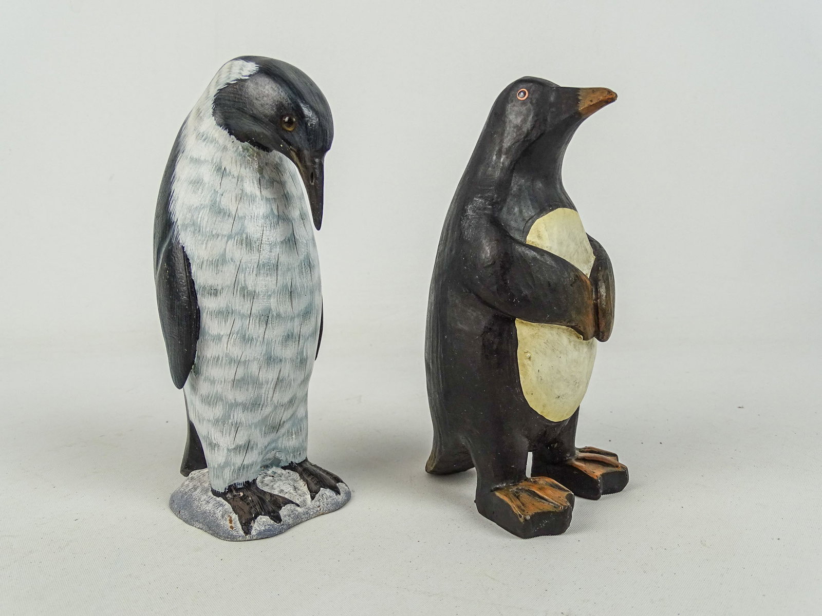 Two Folk Art Penguins: Lot (2) folk art painted wooden carved Penguins. 6 1/2" Ht..