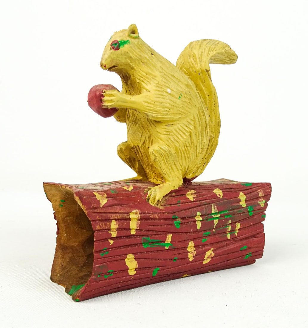 Folk Art Squirrel: Folk art carved wooden Squirrel. 5" W., 5" Ht..