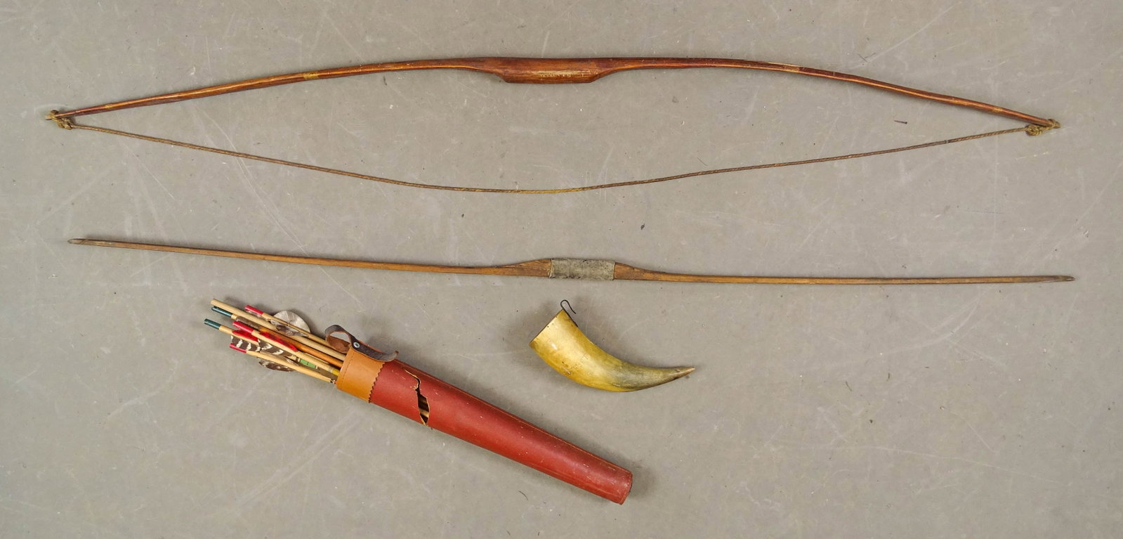 Bow and Arrow Lot: Lot including (2) bows (53" L.), and quiver with arrows and horn.