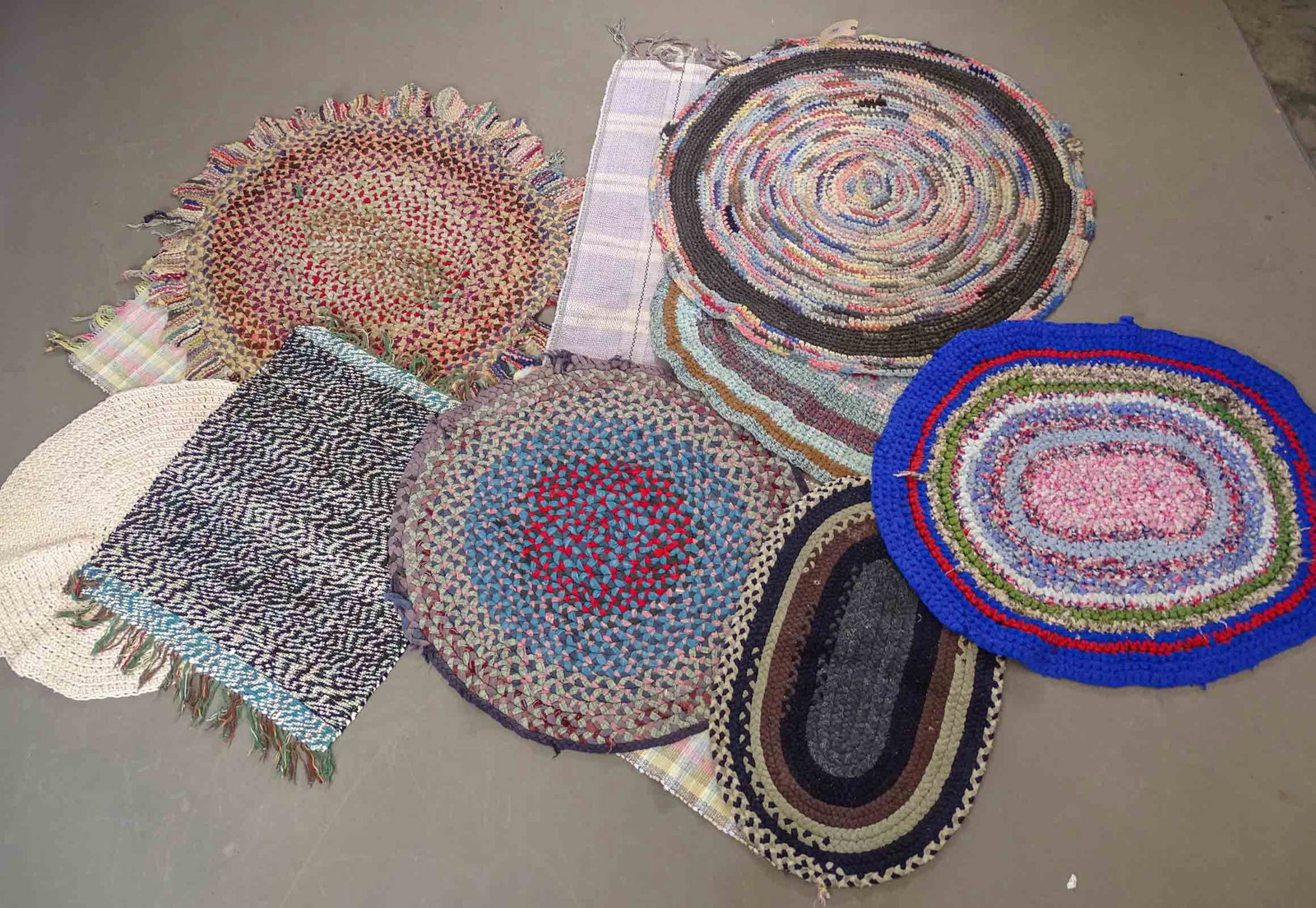 Rag Rugs Lot: Lot of assorted rag rugs. 39" x 33", 21" x 33", 36" D., 22" x 38", 28" x 31", 24" x 44", 29" D., 39" D., 28" x 80", 48" D..