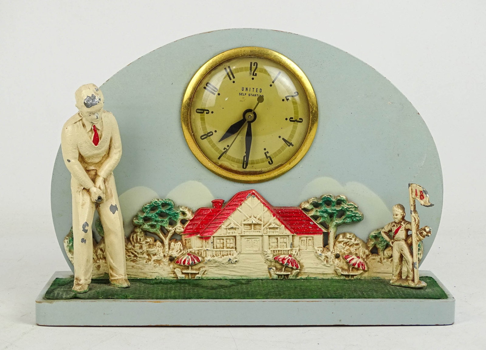 Vintage Golf Clock: Vintage Golf Clock. "UNITED SELF STARTING". Wood with metal figures.. 11" W., 8 1/2' Ht..