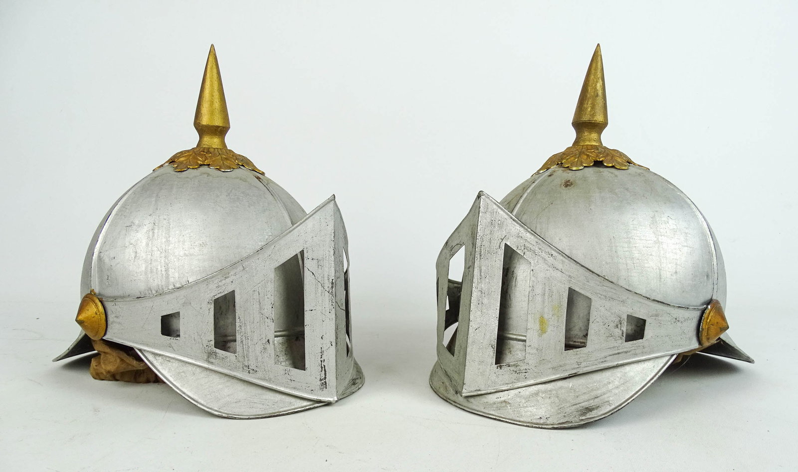 Pair of Prussia Style Helmets: Pair of Prussia style helmets. 10" Ht..