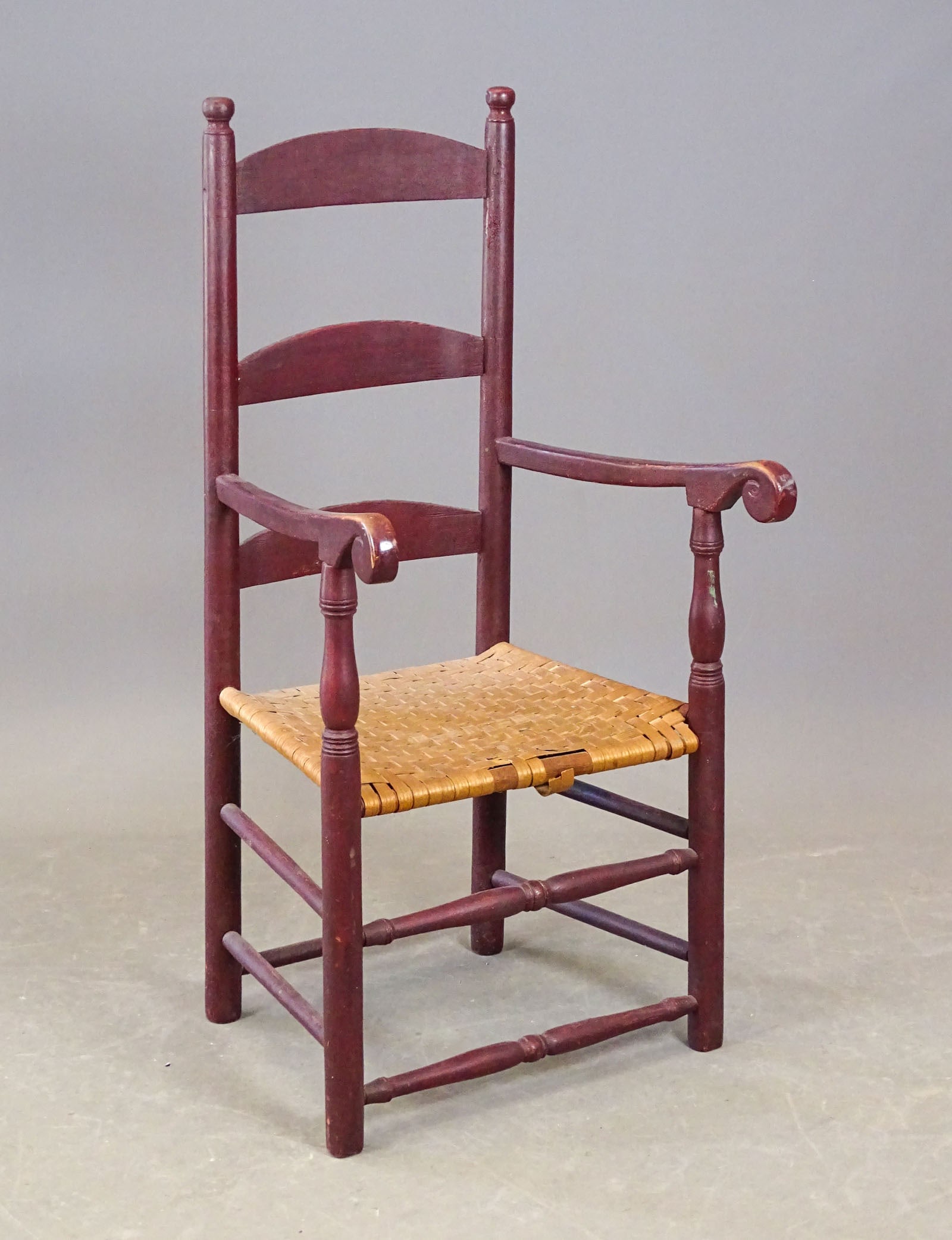 18th c. New England Ladderback Chair: 18th c. New England ladderback splint seat armchair in red paint.