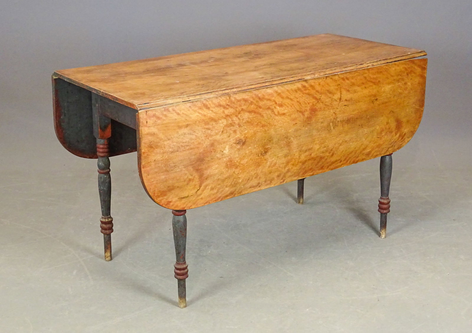 19th c. Sheraton Dropleaf Table: 19th c. country scrubbed top Sheraton dropleaf table in old blue and red paint. 48" L., 20 3/4" W., 13" leaves, 28" Ht..