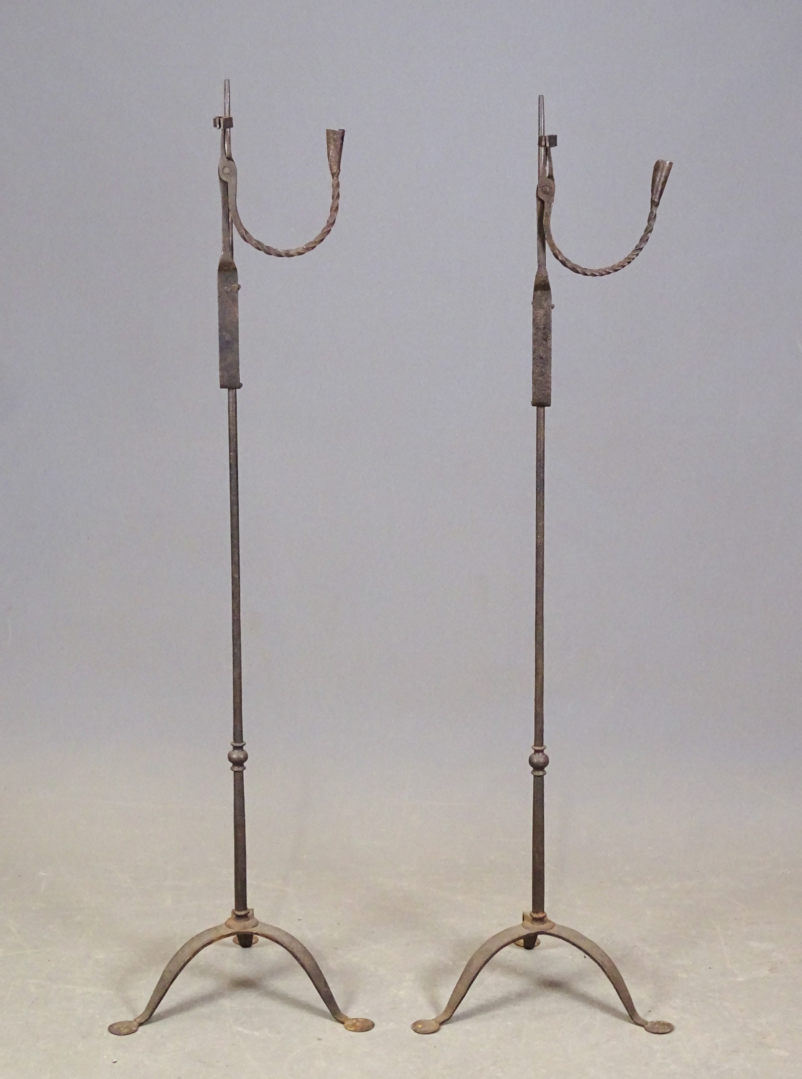 Pair Iron Floor Stands: Pair of iron floor standards. 52 1/2" Ht..