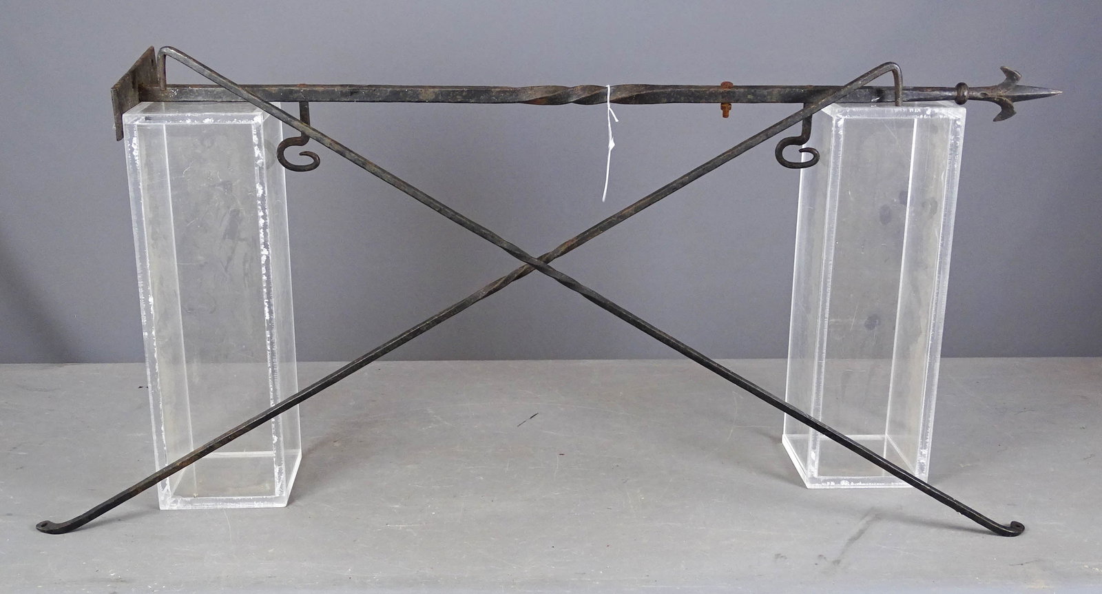 Iron Sign Bracket: Iron sign bracket. 43" L.. Along with (2) metal objects. 44" L..