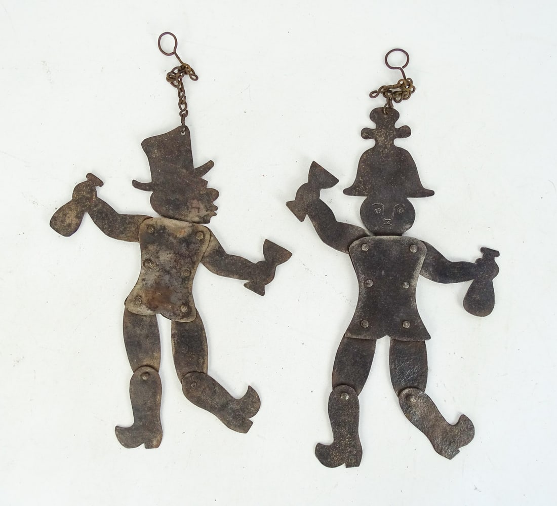 Folk Art Iron Whimsey Figures: Two folk art iron Whimsey figures. Articulated. 14" Ht..