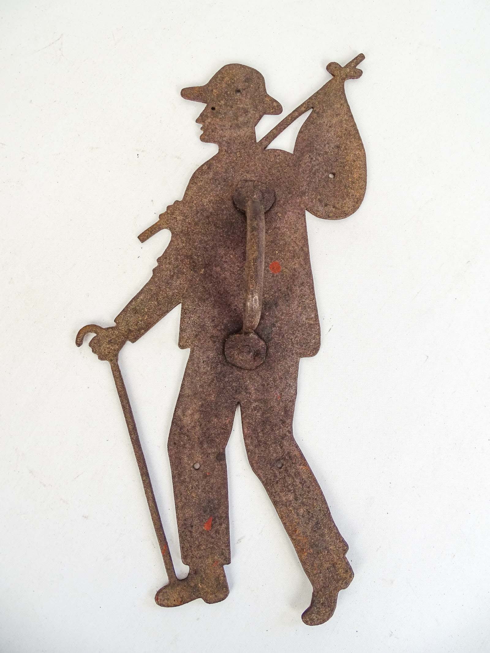 Figural Door Handle: Ironn figure with can and carrying back door handle. 14" L..