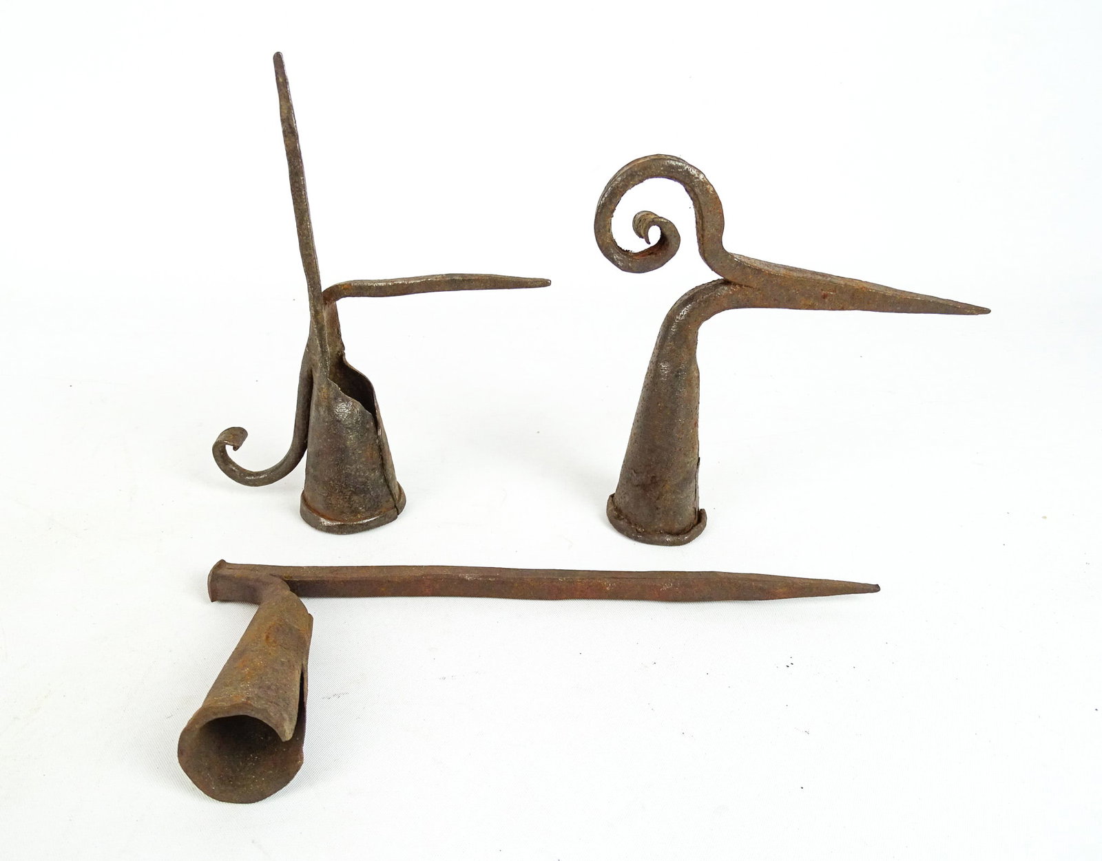 Iron Sticking Tommy Candleholders: Lot (3) iron Sticking Tommy candle holders. Longest 9" L..