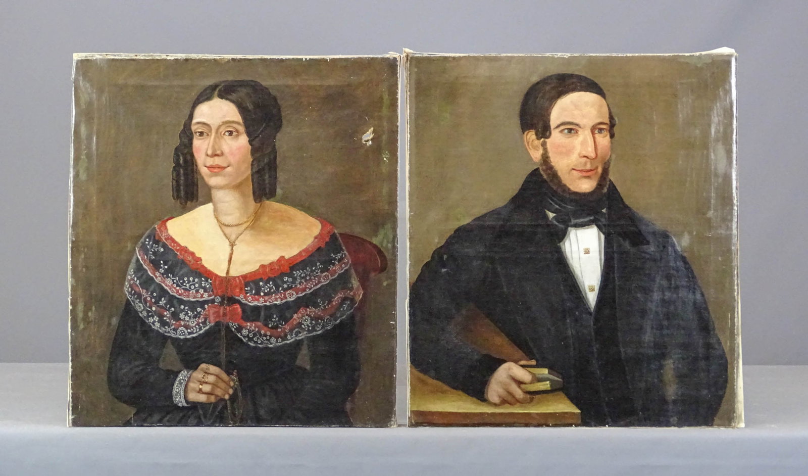 Pair 19th c. Folk Art Portraits: Pair of early 19th c. American folk art portraits. Women portrait damaged (27 3/4" x 24 1/2"), the other 28" x 24 3/4".