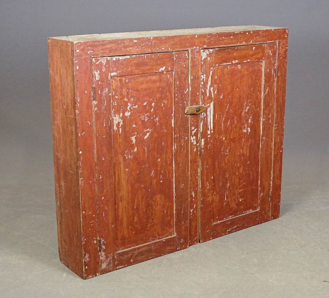 19th c. Cupboard: 19th c. two door cupboard in red paint. 42 1/4" x 8 3/4" x 36" Ht..