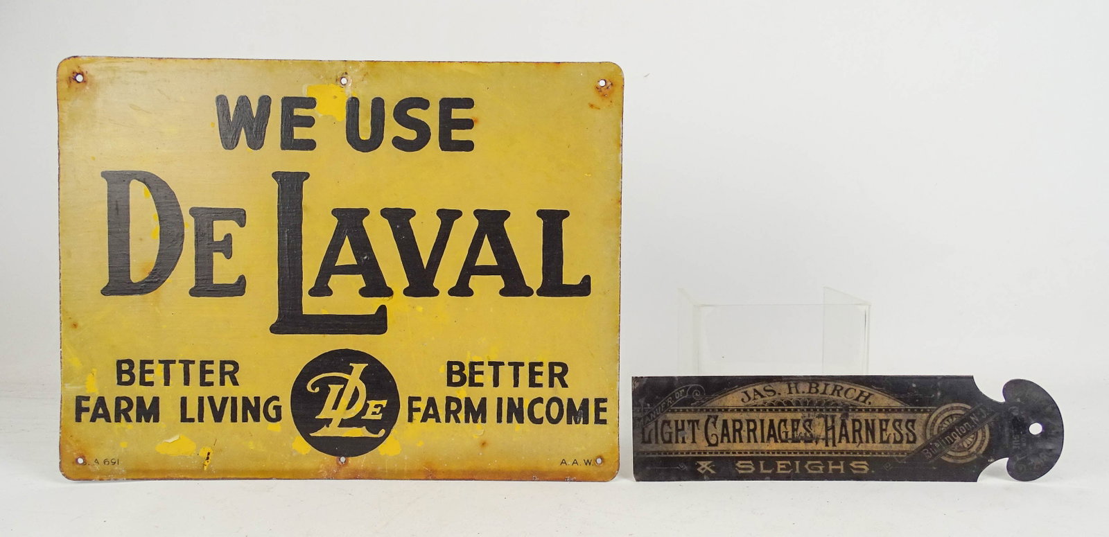 Trade Sign: Painted metal trade sign "WE USE DE LAVAL…". 12" x 16", along with small tin sign "JAS. H. BIRCH. LIGH CARRIAGES HARNESS, BURLINGTON, N.J…" (12" x 3 1/2").