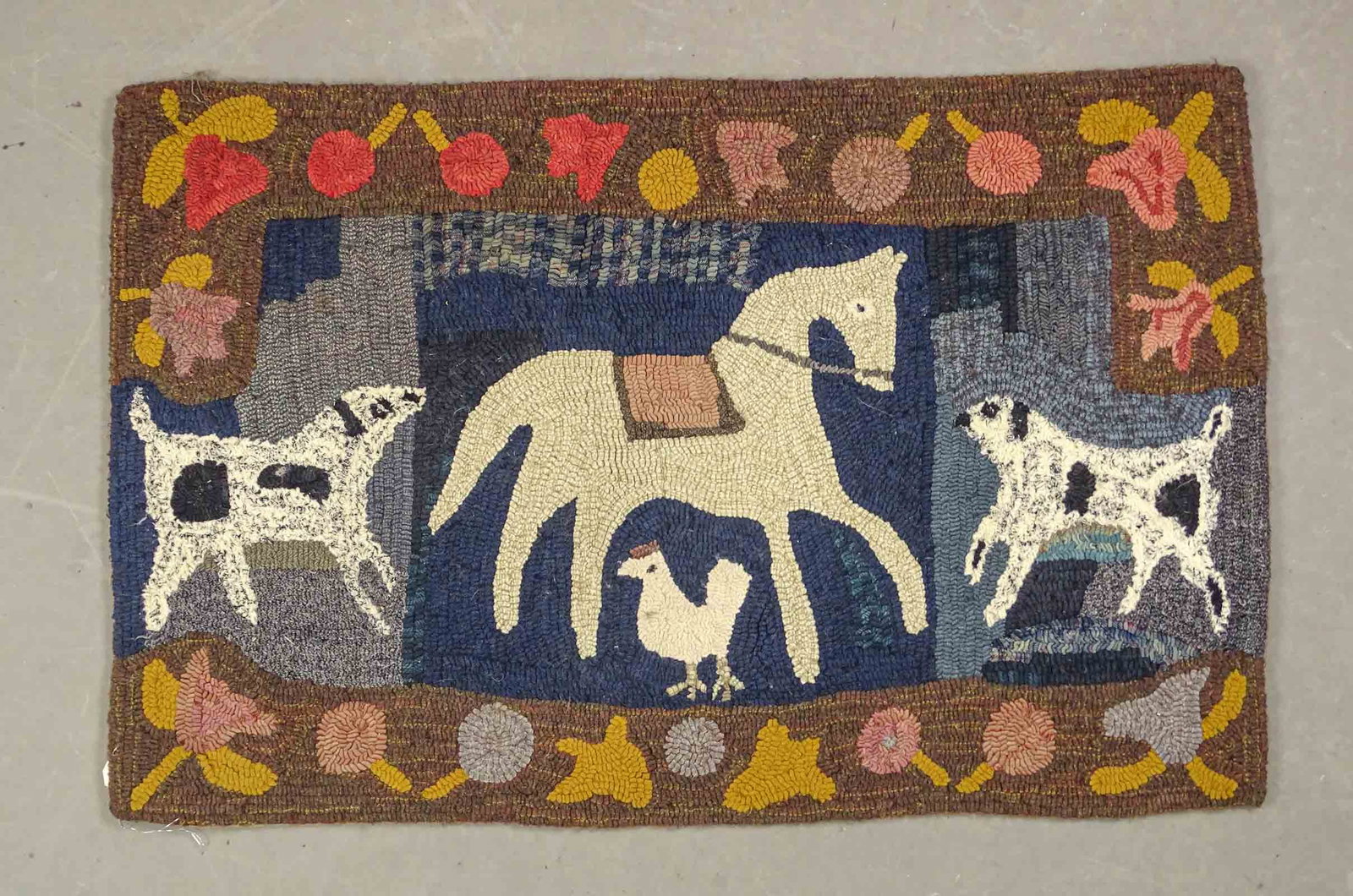 Hooked Rug: Folk art hooked rug with various animals. 26" x 39".