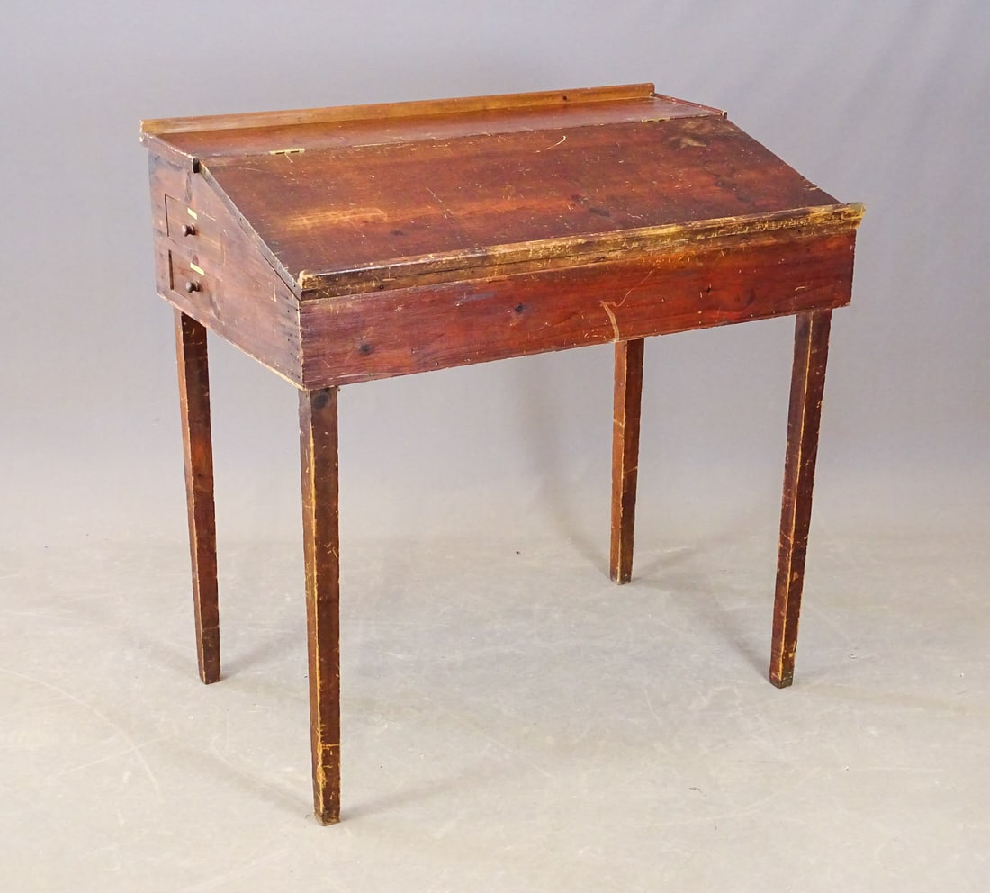 19th c. Desk: 19th c. station masters slant lid desk haivng two drawers on each end. 43" x 28 1/4" x 44" Ht..