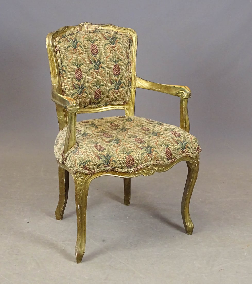 French Louis XV Armchair: French Louis XV style carved and gilt armchair with pineapple patterned upholstery. 17" seat Ht., 32 1/2" overall Ht..