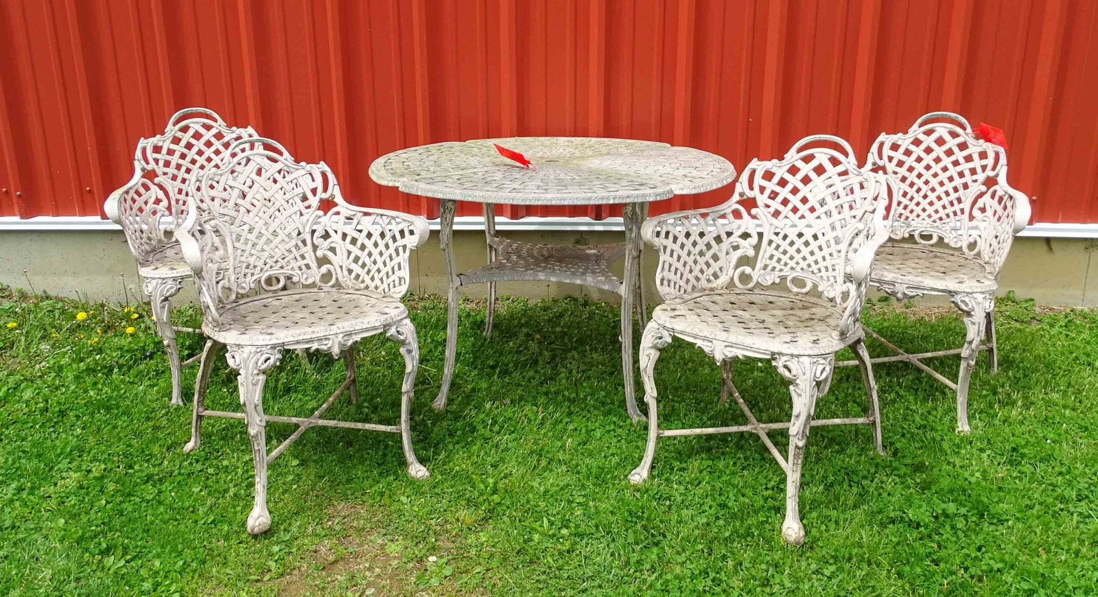 Patio Set: Aluminum patio set including (4) basket weave armchairs (16 1/2" seat Ht., 32" overall Ht.), matching table (41" D., 27 1/2" Ht.).