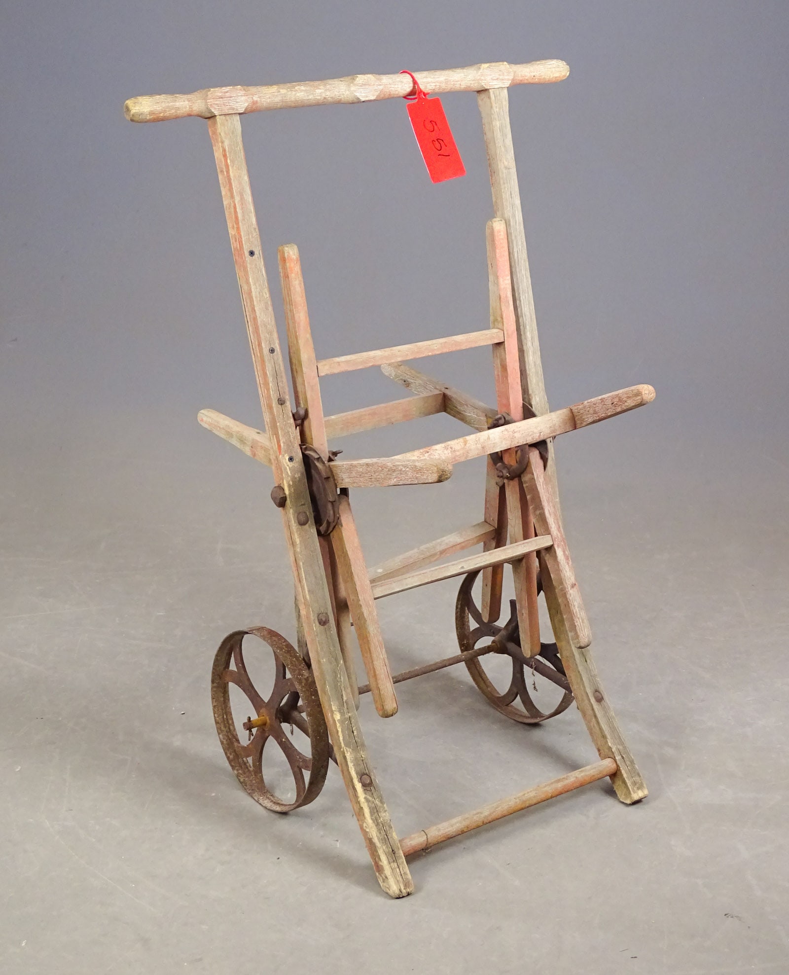 Hose Reel: Early cast iron hose reel with cast iron wheels. 37" Ht..