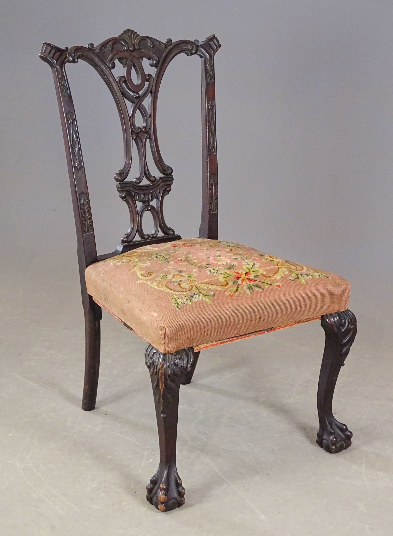 Chippendale Style Chair: Chippendale style carved side chair with needlepoint upholstered seat. Carved ball and claw feet. 18 1/2" seat Ht., 39" overall Ht..