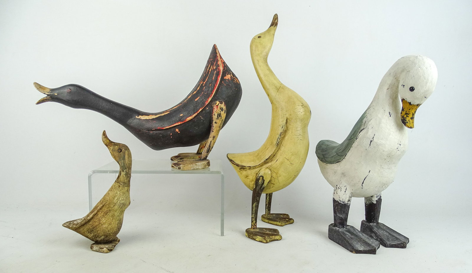 Folk Art Wooden Ducks: Collection of (4) folk art carved wooden ducks. Tallest 17" Ht..