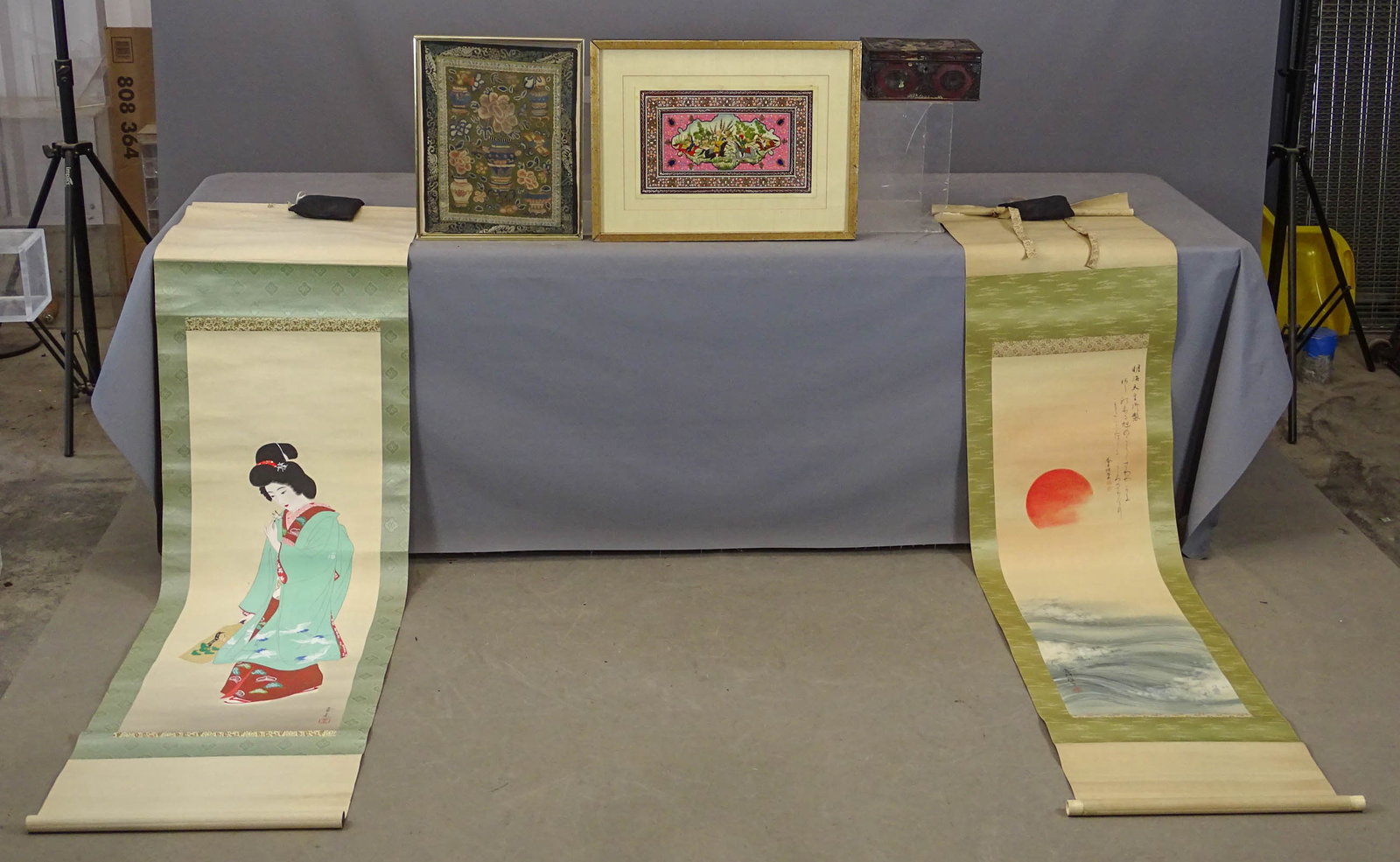 Asian Lot: Asian lot including: (2) Japanese Scrolls, Bijin-GA style with lady holding flower (79" x 21" total length), Sunrise over Seawaves "Hiivomaru" (Rising Sun), 80" x 18 3/4" total length, Chinese