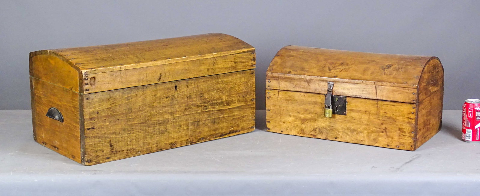 Dometop Trunks: Lot (2) 19th c. dometop trunks. One with 1838 Albany Argus newspaper lined interior (19" x 12" x 11"), the other 23" x 14" x 12").