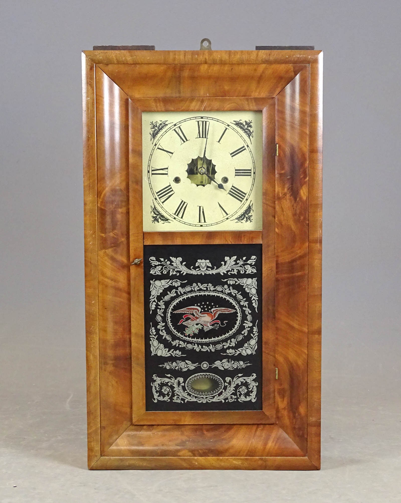 19th c. Ogee Clock: 19th c. mahogany case Ogee clock. Labeled E.N. WELCH FORRESTVILLE CT.. Weights and pendulum inside clock. 16" x 29", 5" D..