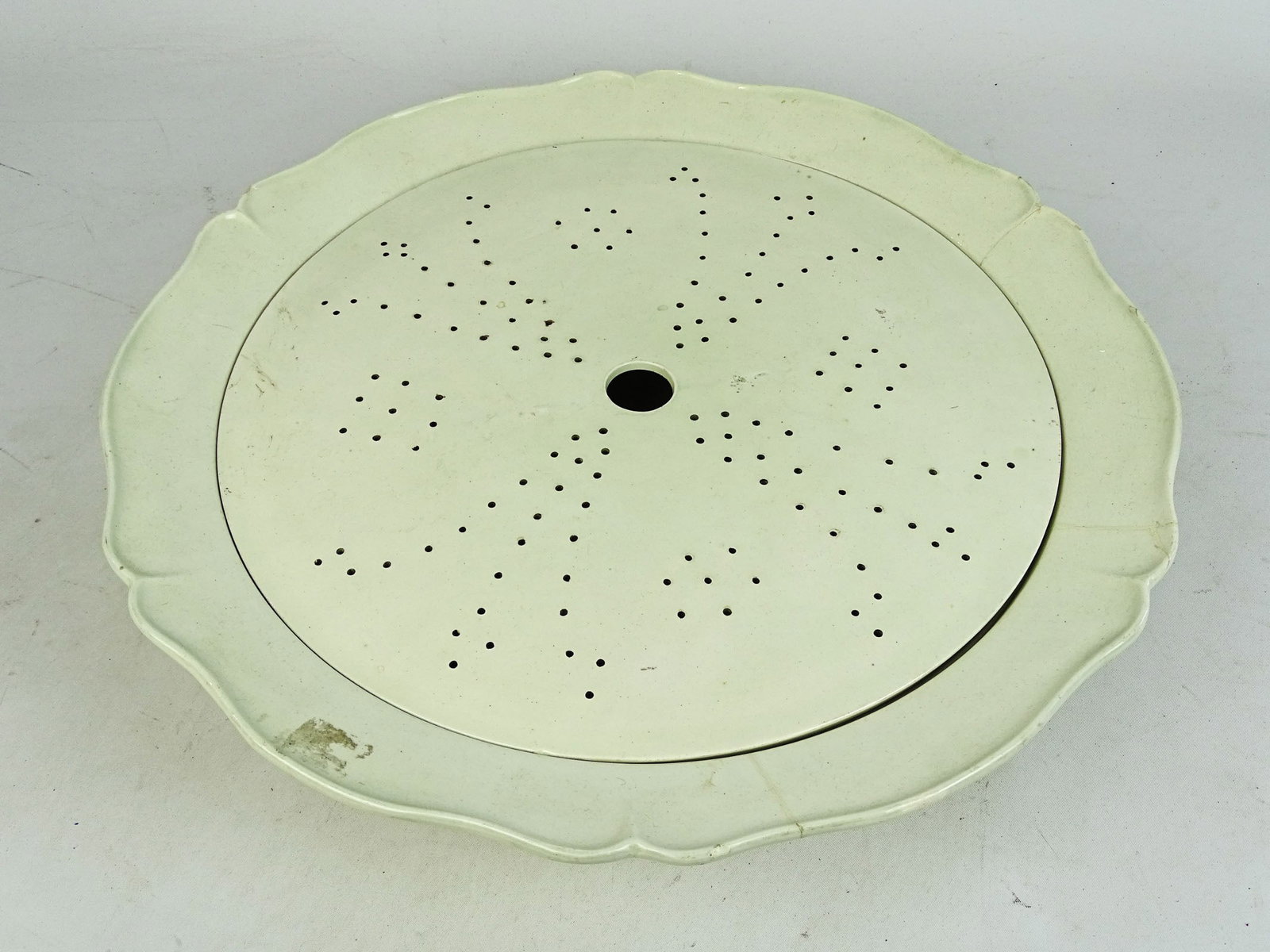English Soft Paste Strainer Bowl: 19th c. English Soft Paste strainer bowl. 16" D., 3 1/2" Ht.. As is, repairs.