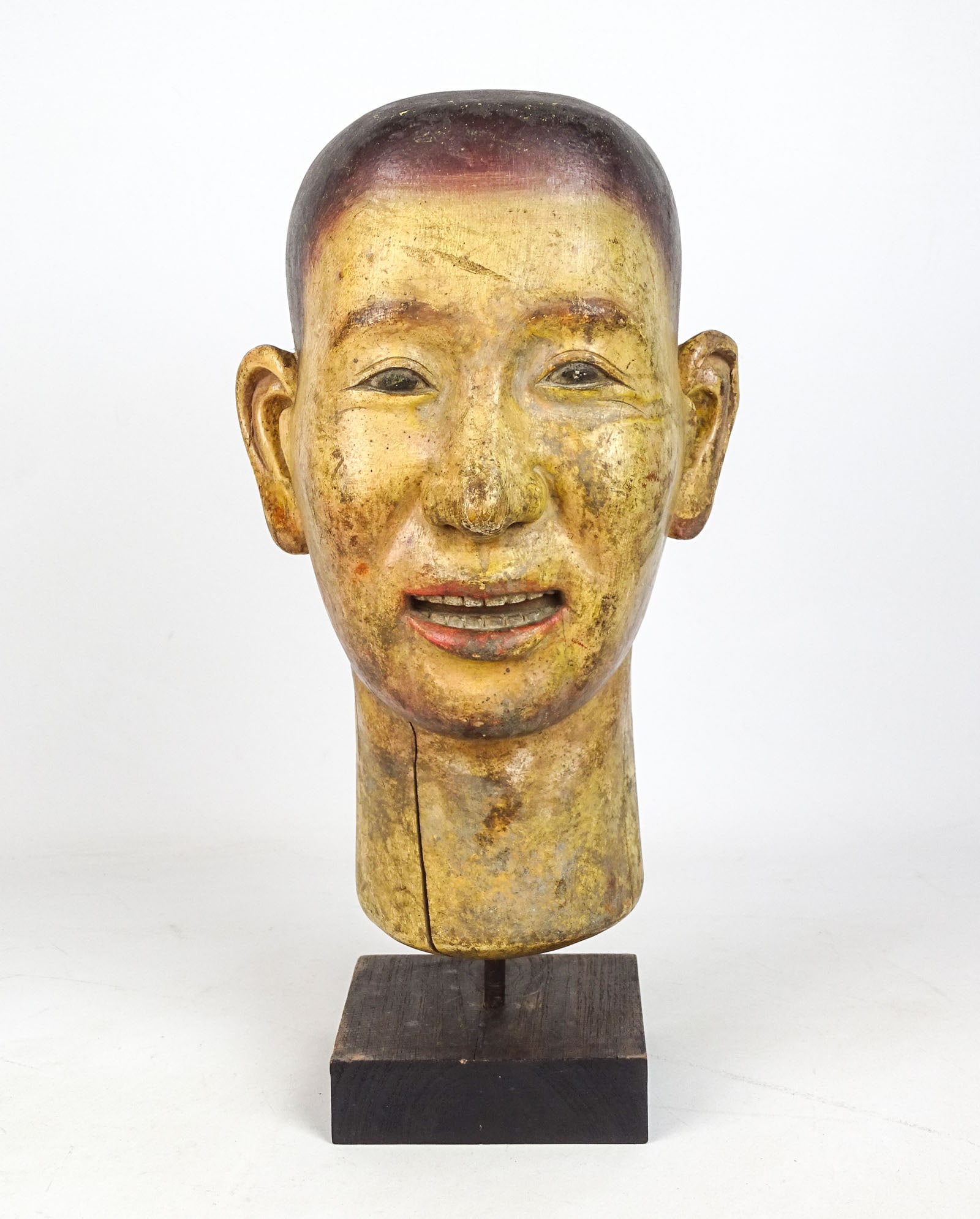 Folk Art Carved Wooden Head: Folk art carved and polychrome painted wooden mans head. 7" x 7" x 13" Ht..