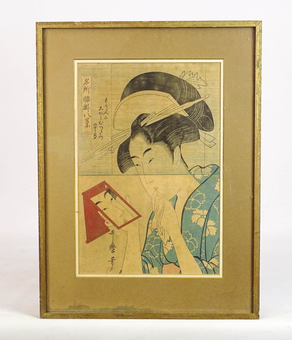 Japanese Woodblock Print: Japanese woodblock print of a woman by Kitagawa Utamaro (C. 1753-1806). Overall in frame 20 1/2" x 15 1/2".