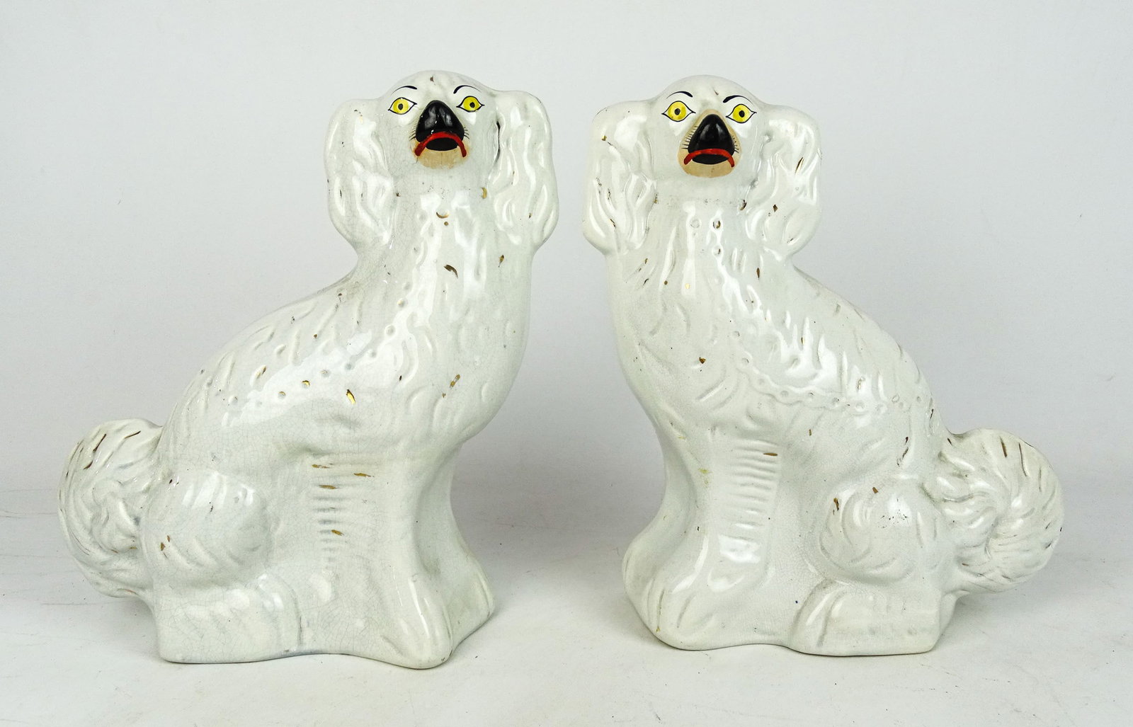 Pair 19th c. Staffordshire Spaniels: Pair of 19th c. Staffordshire Spaniels. 11" W., 14" Ht..