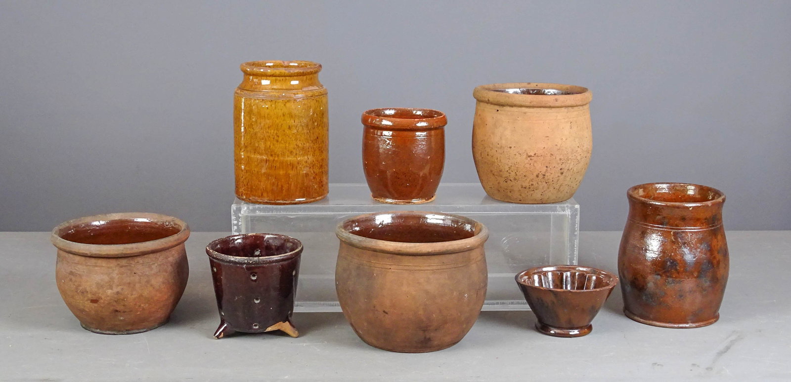 Redware Lot: Lot (8) pieces of early redware including planters, pots etc..