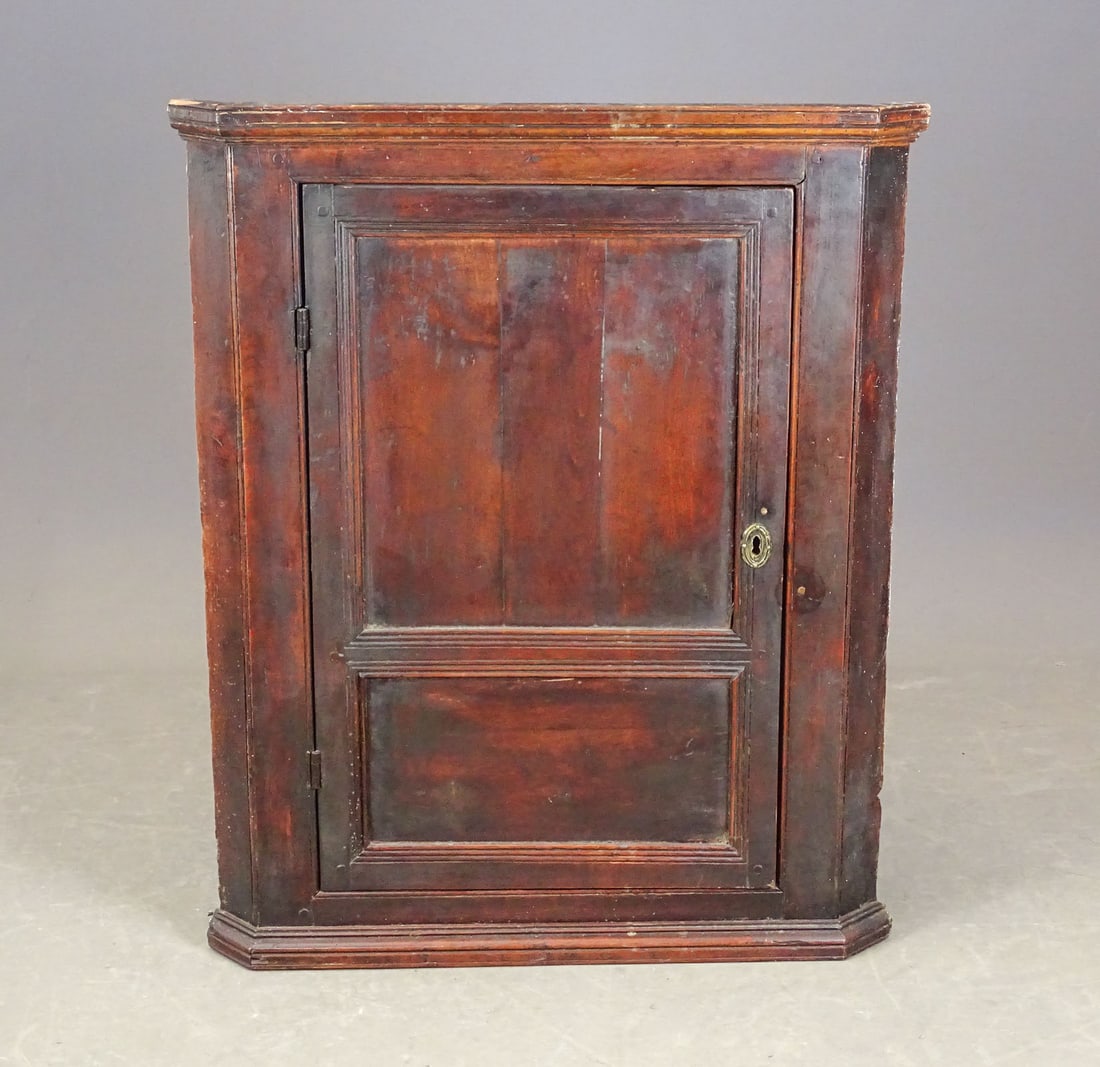 18th c. Hanging Corner Cupboard: 18th c. paneled door hanging corner cupboard. 28" x 19 1/2" x 34 1/2" Ht..