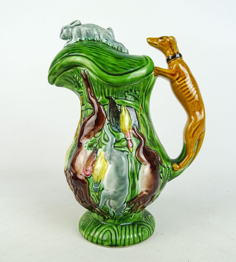 Pitcher: Pitcher with hound handle and game theme. 11" Ht.. Made in Portugal.