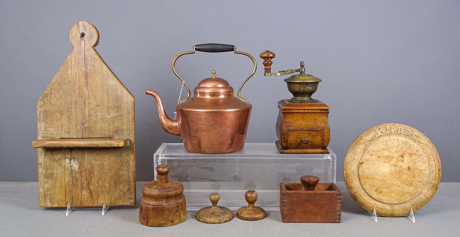 Primitive Lot: Primitive lot including: 19th c. spoon rack (10" x 18"), copper teapot (12" x 12"), brass and wood coffee grinder (5" x 6" x 12"), wooden plate, molds.
