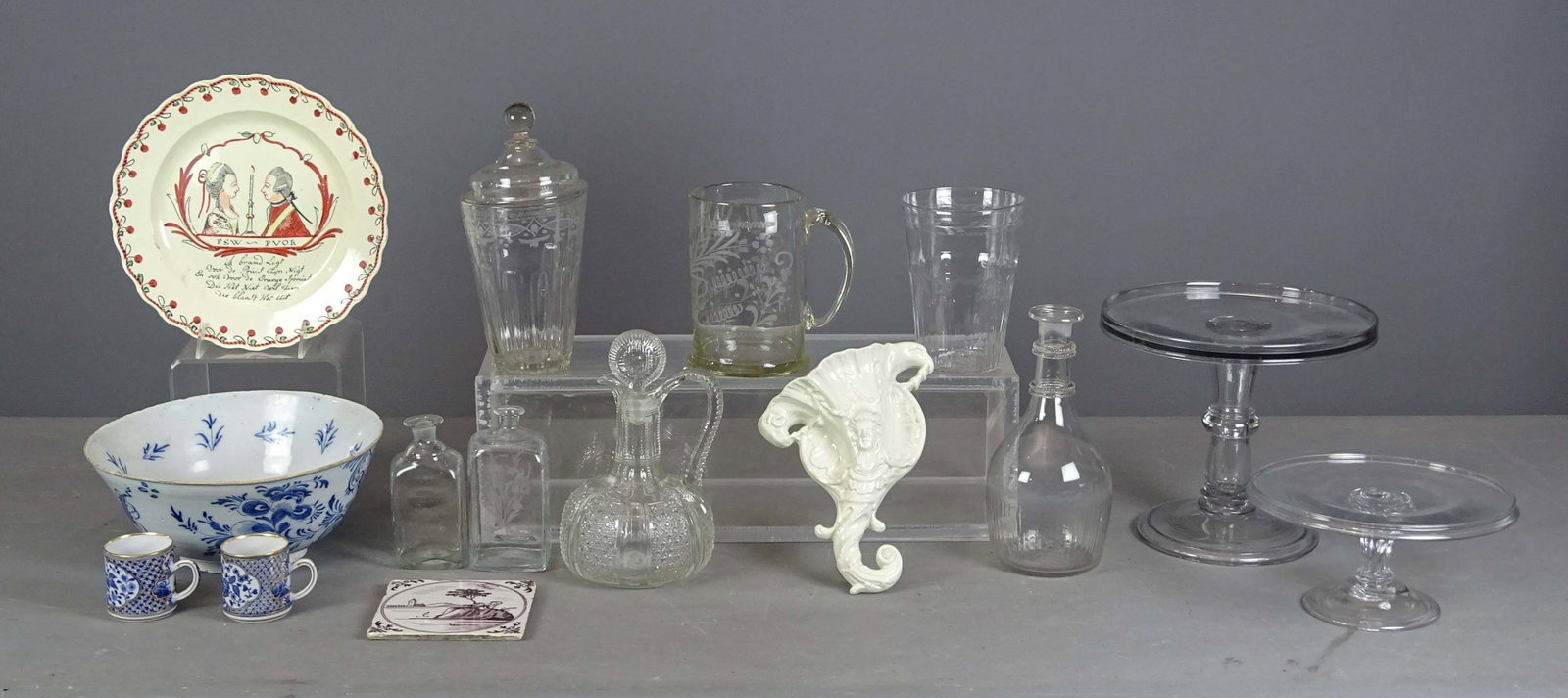 Early Glassware Lot: Lot including: Early etched mug (6 1/2" Ht.), etched lidded jar (interior of lid as is, 10" Ht.), pattern glass pitcher, (2) early bottles (tallest 6" Ht.), plate marked "FSW-PVOR" (10" D.), 18th c.
