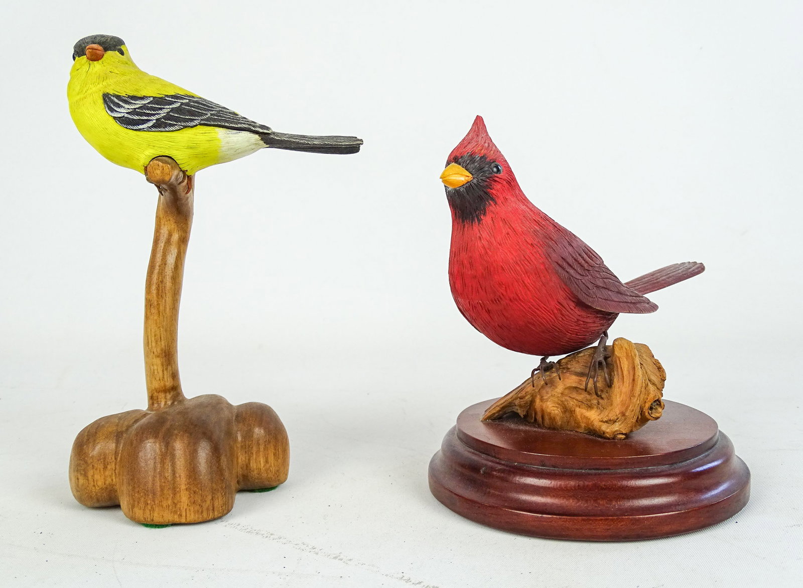 Bird Carvings: Lot (2) bird carvings including: "American Goldfinch by R. Padua 9/9/99" (7 1/2" Ht.), the other signed "H. VANDERWERE" (6 1/2" Ht.).