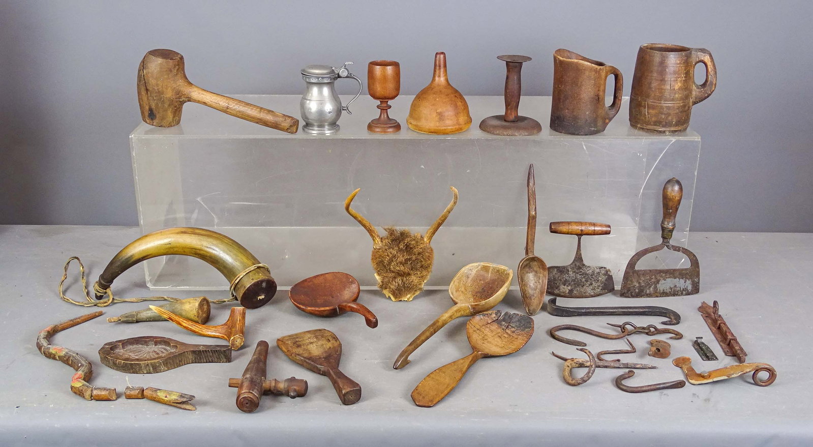 Primitive Lot: Primitive lot including: Carved spoons, funnel, horn, folk art snake, choppers, molds, mallet, iron hardware, choppers, horns, pewter mug etc..