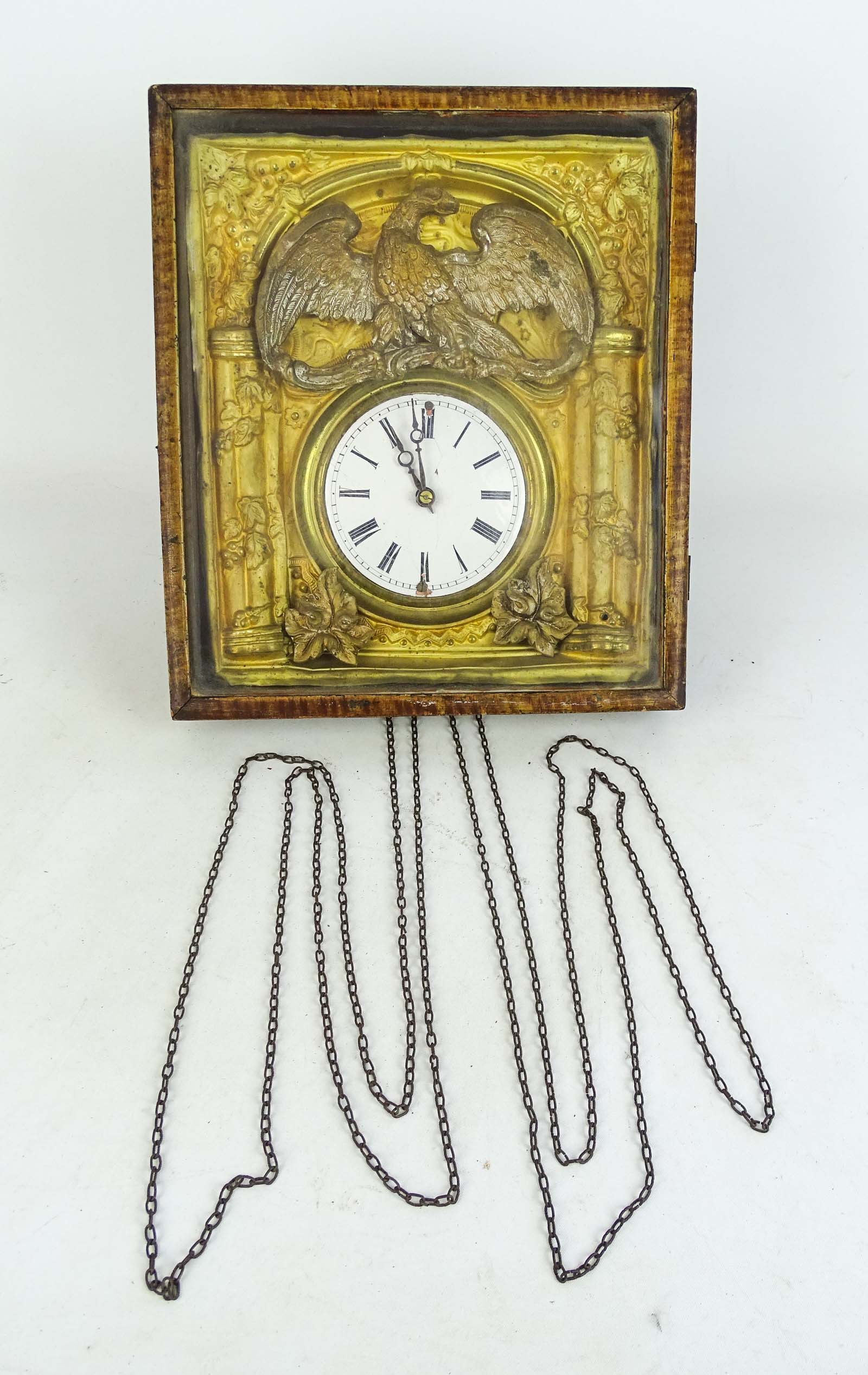 19th c. Wall Clock: 19th c. punched metal eagle wall clock. 12" x 13" x 6 /12" D., retains weights and pendulum.