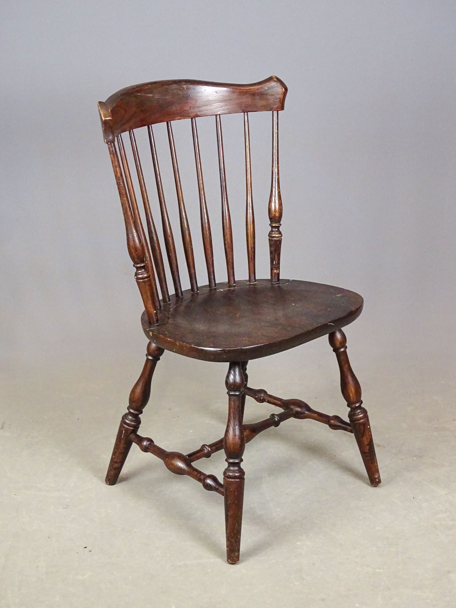 Hitchcock Chair: Windsor oak chair by The Hitchcock Chair Company, signed in back of seat "L. Hitchcock, Hitchcocksville, Conn. Warranted." 18" seat Ht., 34" overall Ht..