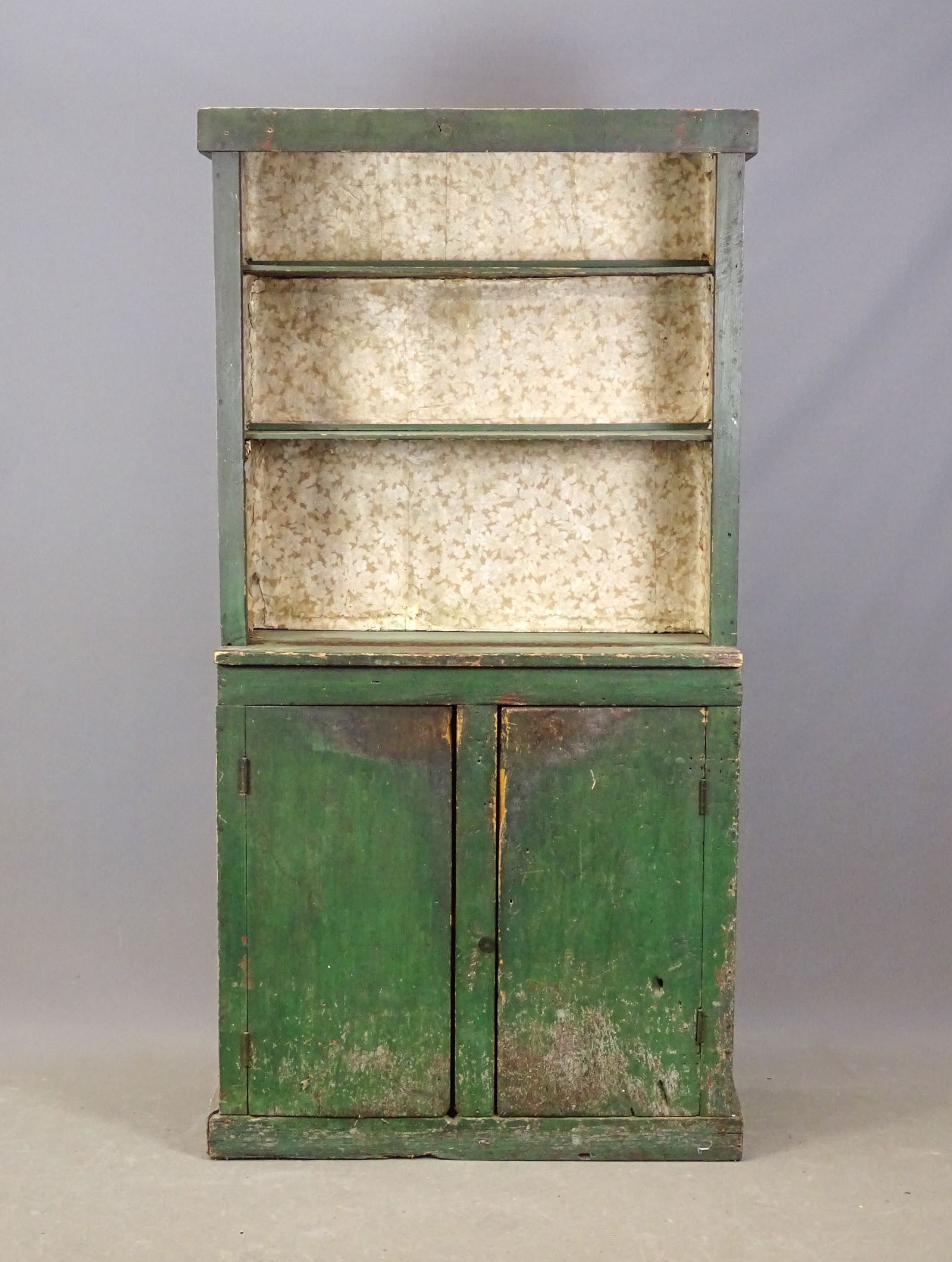 19th c. Stepback Cupboard: 19th c. stepback cupboard in old green paint. 38" x 16 1/2" x 76" Ht..