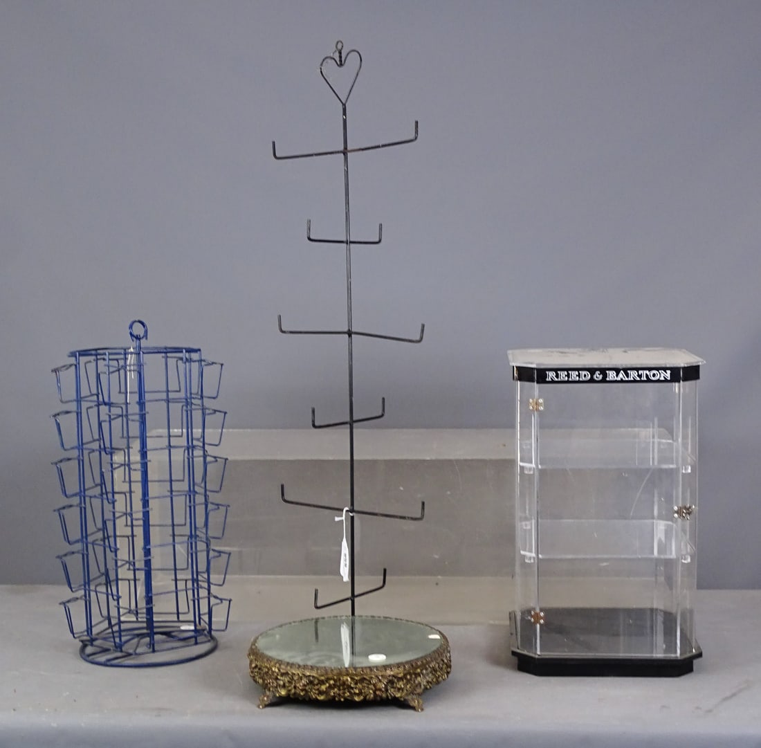Reed & Barton Showcase Lot: Lot including: Post card metal rack (11" D., 22" Ht.), hanging metal rack (39" L., note heart top), and plastic Reed & Barton showcase (12" x 12" x 19 1/2"), mirrored tray with brass footed base (11"