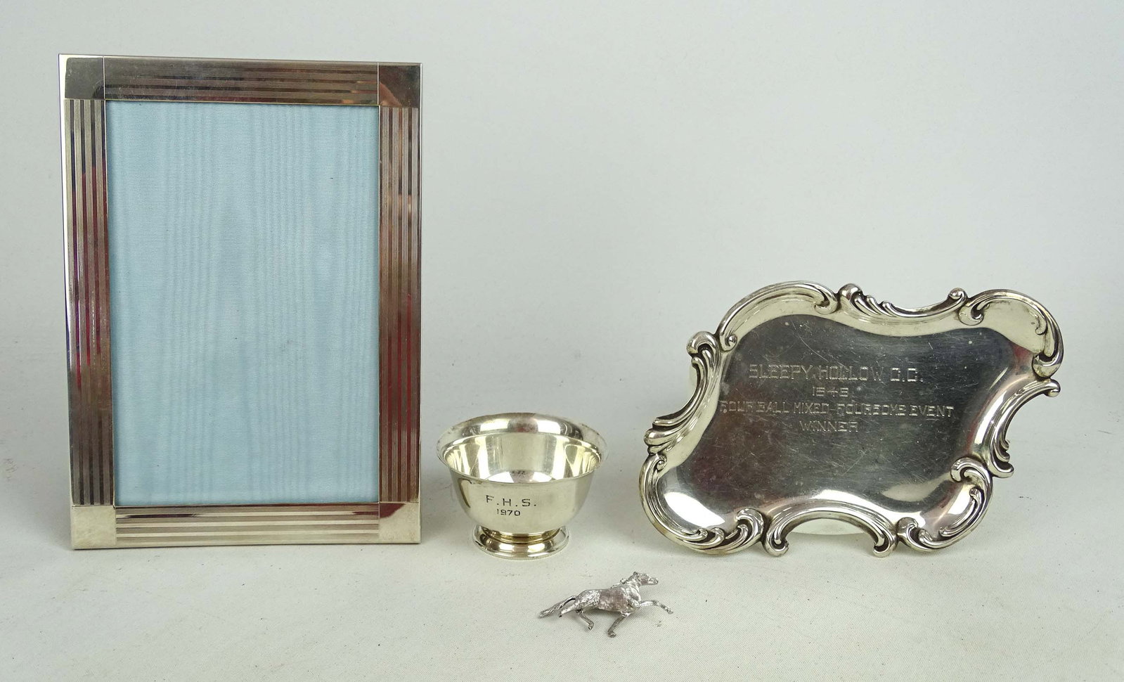 Tiffany Sterling Silver Lot: Tiffany Sterling Silver lot including: Salt, frame (salt 34.2 grams), along with non Tiffany horse pin and tray, both sterling (91.6 grams).