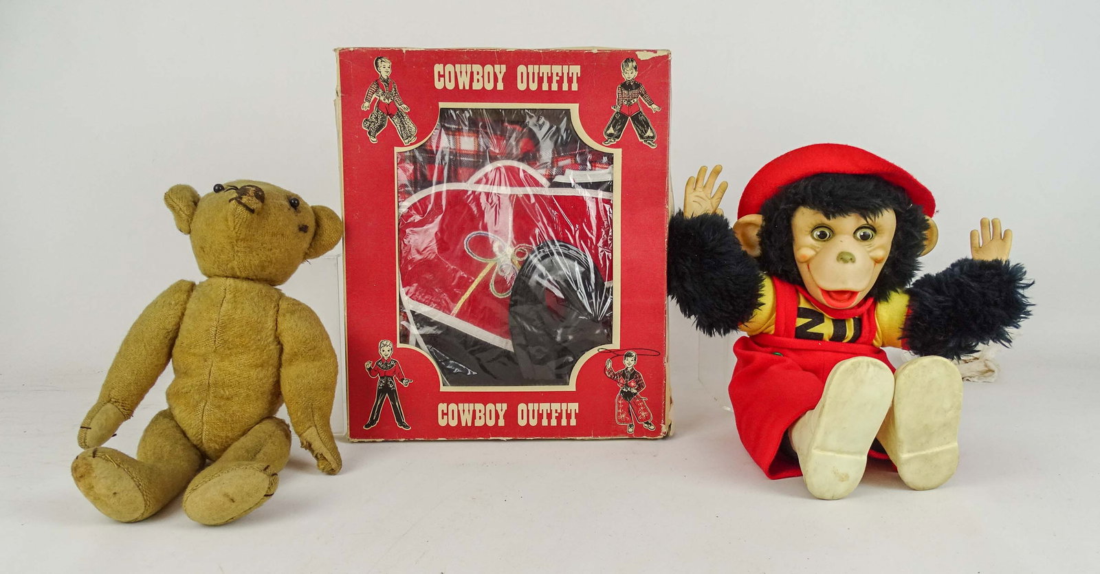 Teddy Bear Lot: Lot including: Early teddy bear (12 1/2" L.), Pla-Master boxed vintage Cowboy outfit (box 11" x 13"), and Zippy Monkey doll (15" L.).