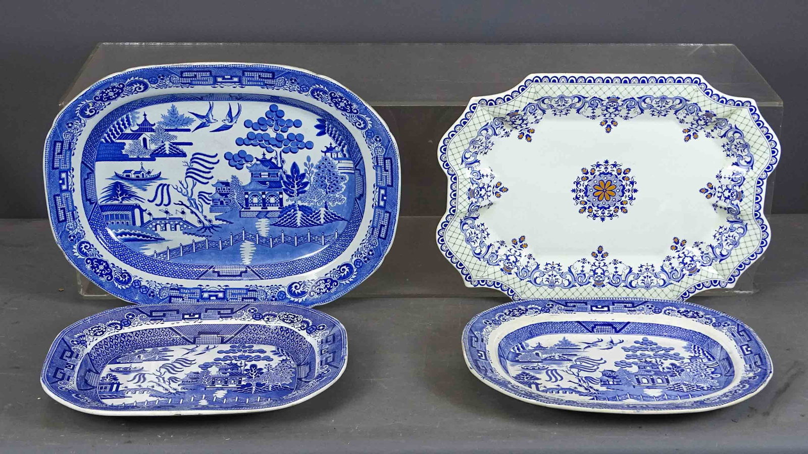 Lot (4) 19th c. Platters: Lot (4) 19th c. blue and white and misc. platters. Includes "GIEN FRANCE" (19" x 14"), the others 15 1/2"-19" L..