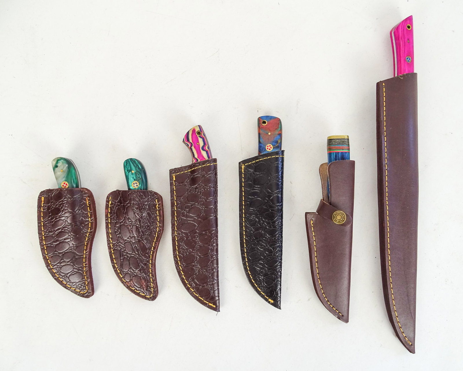 Lot of Handmade Knives: Lot of (6) handmade knives with sheaths. Longest 16" L..