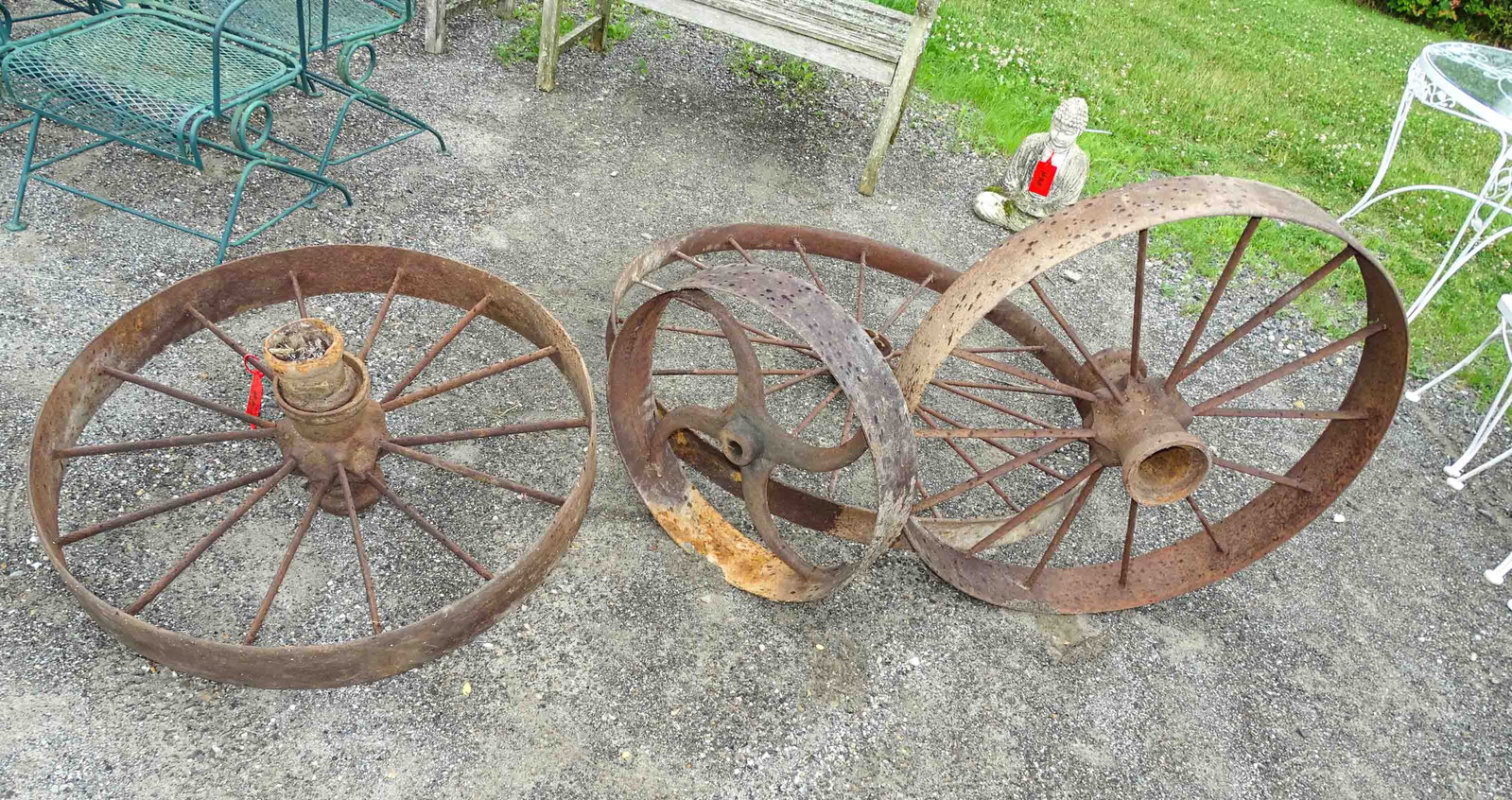 Cast Iron Wheels: Lot (4) cast iron wheels. Largest 48" D..